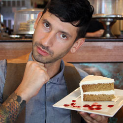 Joshua Katcher with Cafe Blossom’s vegan lemon layer cake (Source: MRNY)