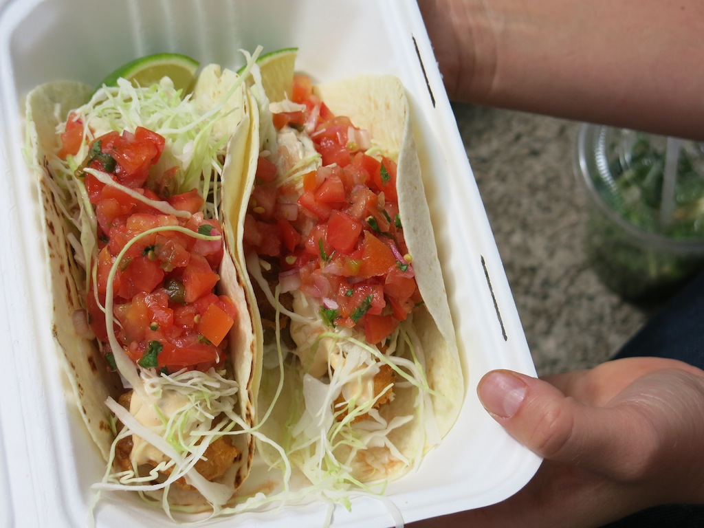 The crispy tempura-battered lingcod is sprinkled with shredded cabbage, drizzled with chipotle mayo, and dotted with salsa fresca. © MRNY